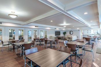 A large room with tables and chairs 